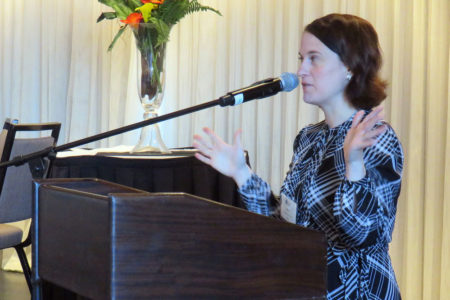 IMG_0775 Molly Flood Kilmer of ABA Division of Bar Services, speaking at a podium.